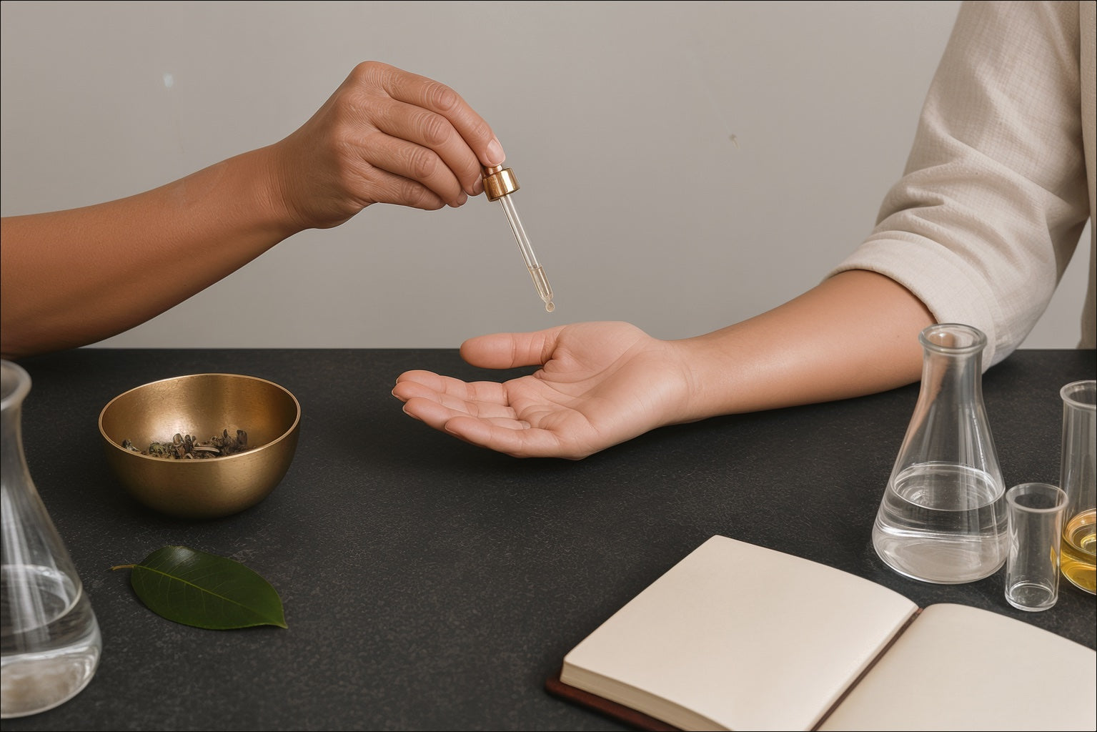 Two generations perform an anointing gesture beside botanical materials and modern laboratory glassware.